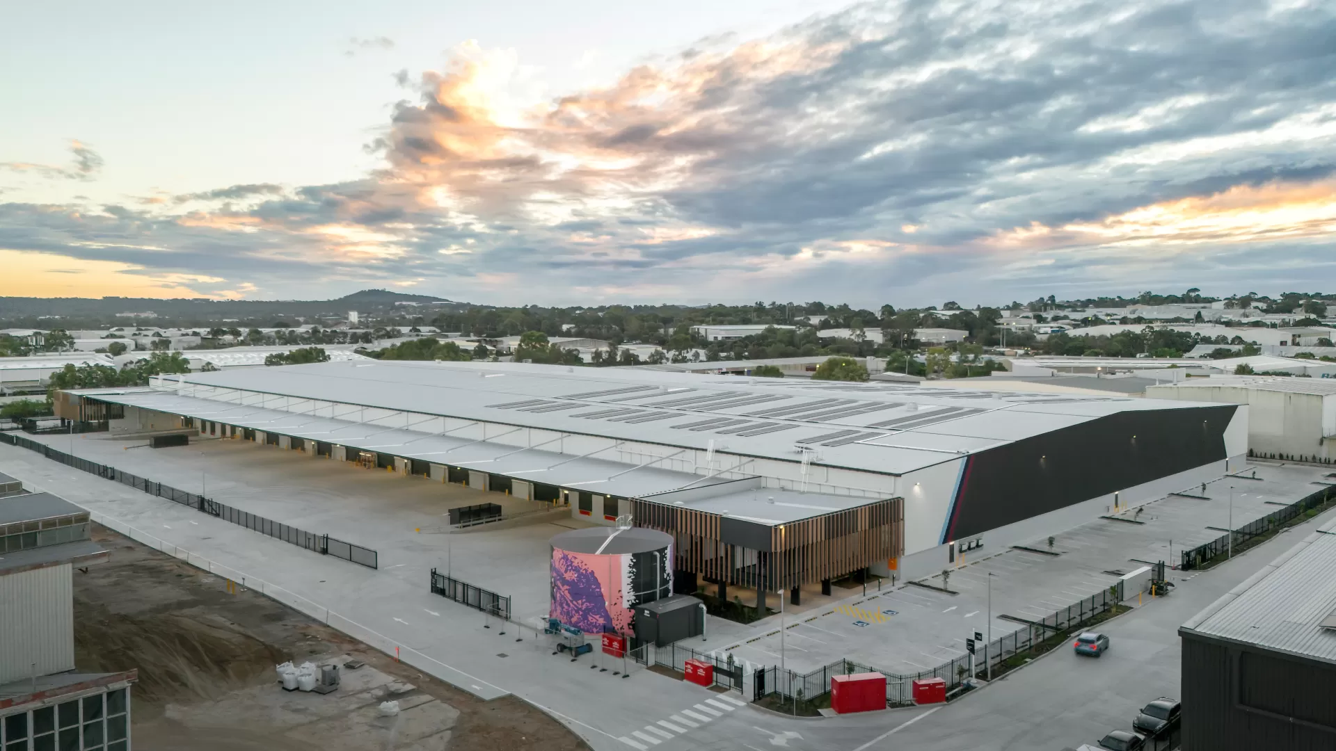 Aerial image of the overall warehouse showing warehouse office, hardstand area carparking and cantilver awning